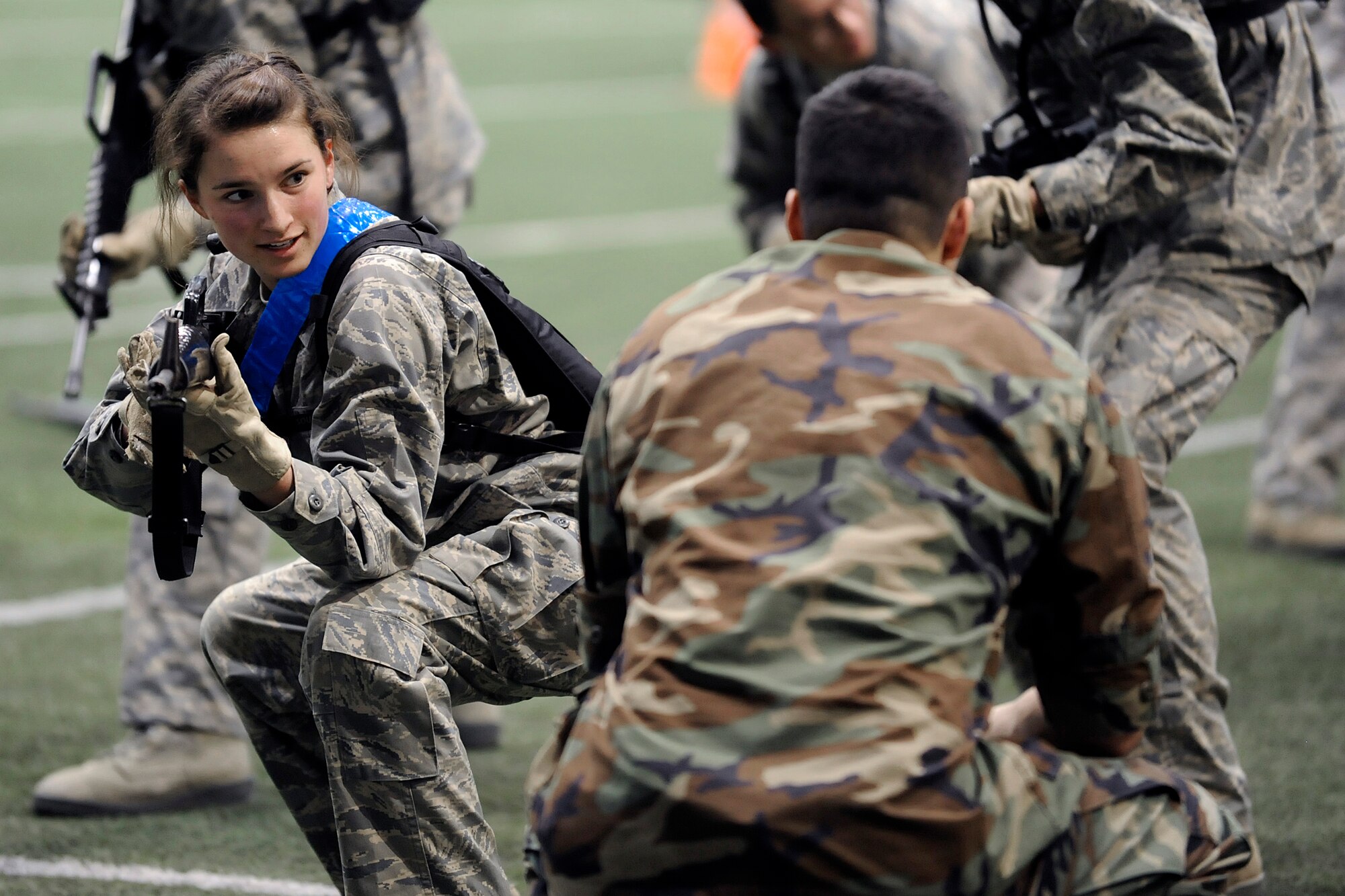 Cadet 4th Class Carly Serratore receives encouragement during Recognition events at the Air Force Academy's Cadet Field House March 12, 2010. Recognition consists of several days of mentally and physically demanding activities and culminates with the ascension of the freshmen into the ranks of upper-class cadets. Cadet Serratore is the daughter of Air Force hockey head coach Frank Serratore. (Air Force Photo/Mike Kaplan)