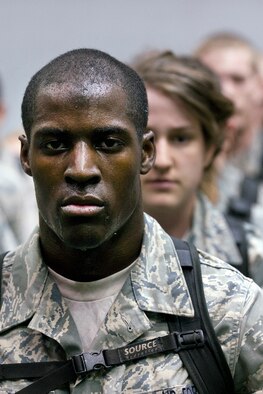 Cadet 4th Class Wesley Cobb of Cadet Squadron 02 stands at attention with his classmates during Recognition at the Air Force Academy March 12, 2010. Recognition is a series of military, physical and mental training that culminates with freshmen receiving upperclassman status. (U.S. Air Force photo/Bill Evans)