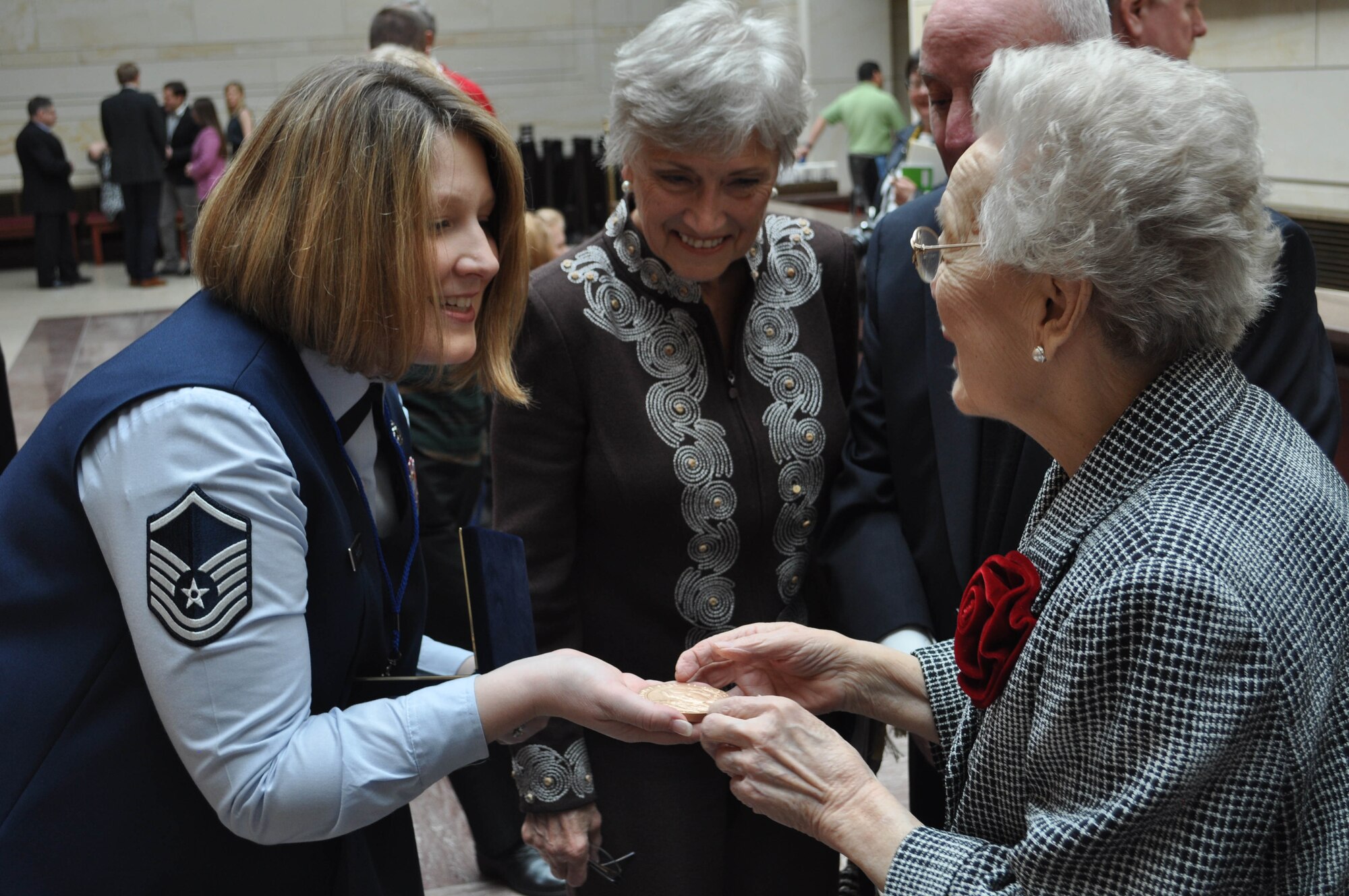 JOINT BASE MCGUIRE-DIX-LAKEHURST, N.J. - Master Sgt. Megan Parrott  is one of 25 Reserve members here who helped present the Women AirForce Service Pilots with a Congressional Gold Medal during the WASP Gold Medal Ceremony held March 10 on Capitol Hill in Washington, D.C. With less than 300 WASPs alive today, about 180 made the trip to the nation's capitol to receive recognition and thanks for their service performed during World War II. (U.S. Air Force photo/Col. Giordano B. McMullen)