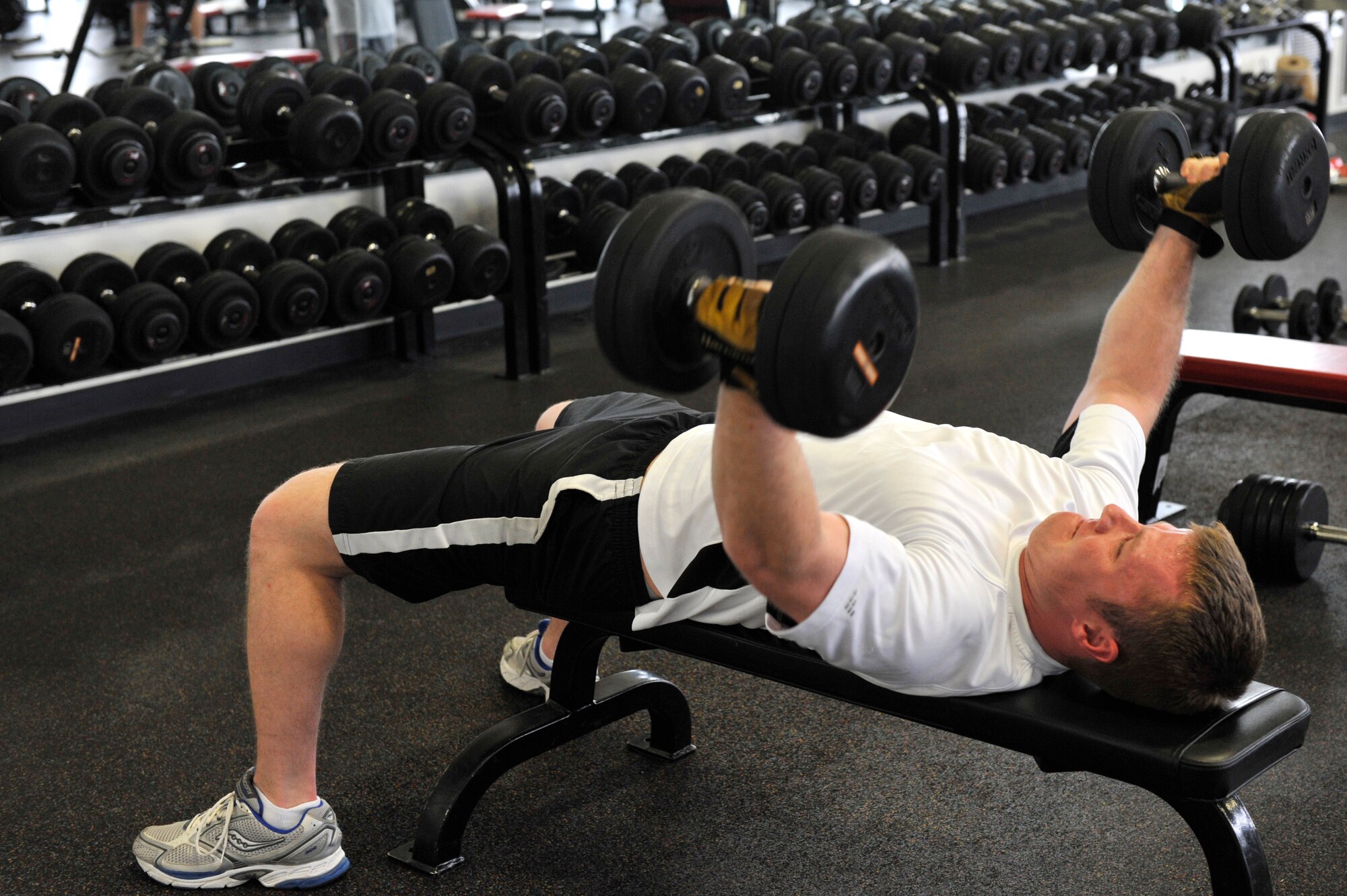 Capt. Jason Robinson, a 53rd Airlift Squadron C-130 pilot, strength trains at the base fitness center in the weight training room. The weight training room allows military members to strengthen their muscles. (U.S. Air Force photo by Senior Airman Christine Clark)