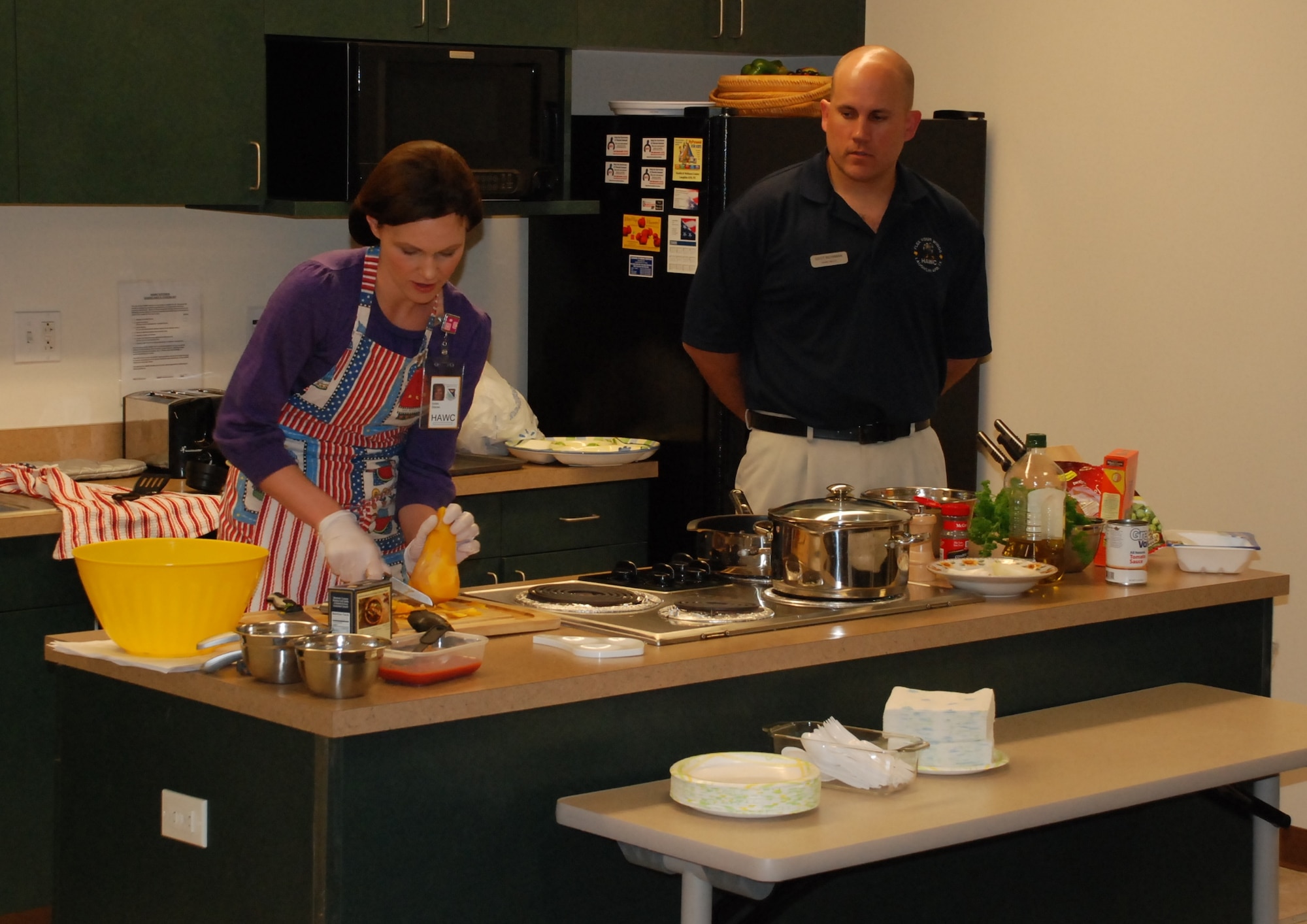 LAUGHLIN AIR FORCE BASE, Texas – Stacee Smith, Laughlin’s Health and Wellness Center dietitian, and Staff Sgt. Kenneth Bowman, a HAWC diet technician, conduct a cooking demonstration at Laughlin’s HAWC March 16 in recognition of National Nutrition Month. Various events are scheduled to be held throughout March to promote healthy eating, including a Nutrition 101 Brown Bag Session March 26 and a tour of Laughlin’s commissary March 30. (U.S. Air Force photo by Airman 1st Class Blake Mize)