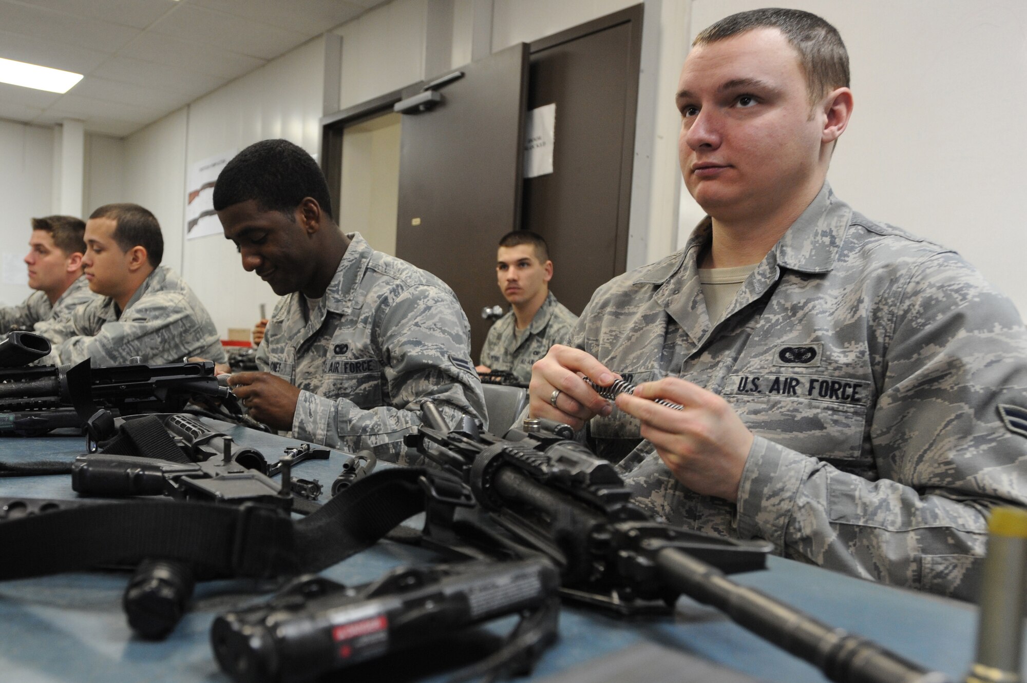 WHITEMAN AIR FORCE BASE, Mo. -  Airman 1st Class Scott Maynard, 509th  Security Forces Squadron patrolman, listens to the combat arms instructor while the disassembling his M-4 carbine here, March 16, 2010.(U.S. Air Force photo by Airman 1st Class Carlin Leslie )(Released)
 








