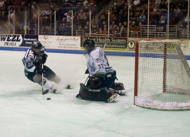 Forward Keith Johnson shoots for a second goal for the South Carolina Stingrays hockey team in the first period during military appreciation night at the North Charleston Coliseum March 12. The Stingrays played strong against the Florida Everblades in the first period giving them a 0-2 lead going into the second period. The Stingrays won 1-3. (U.S. Air Force photo/Staff Sgt. Daniel Bowles)