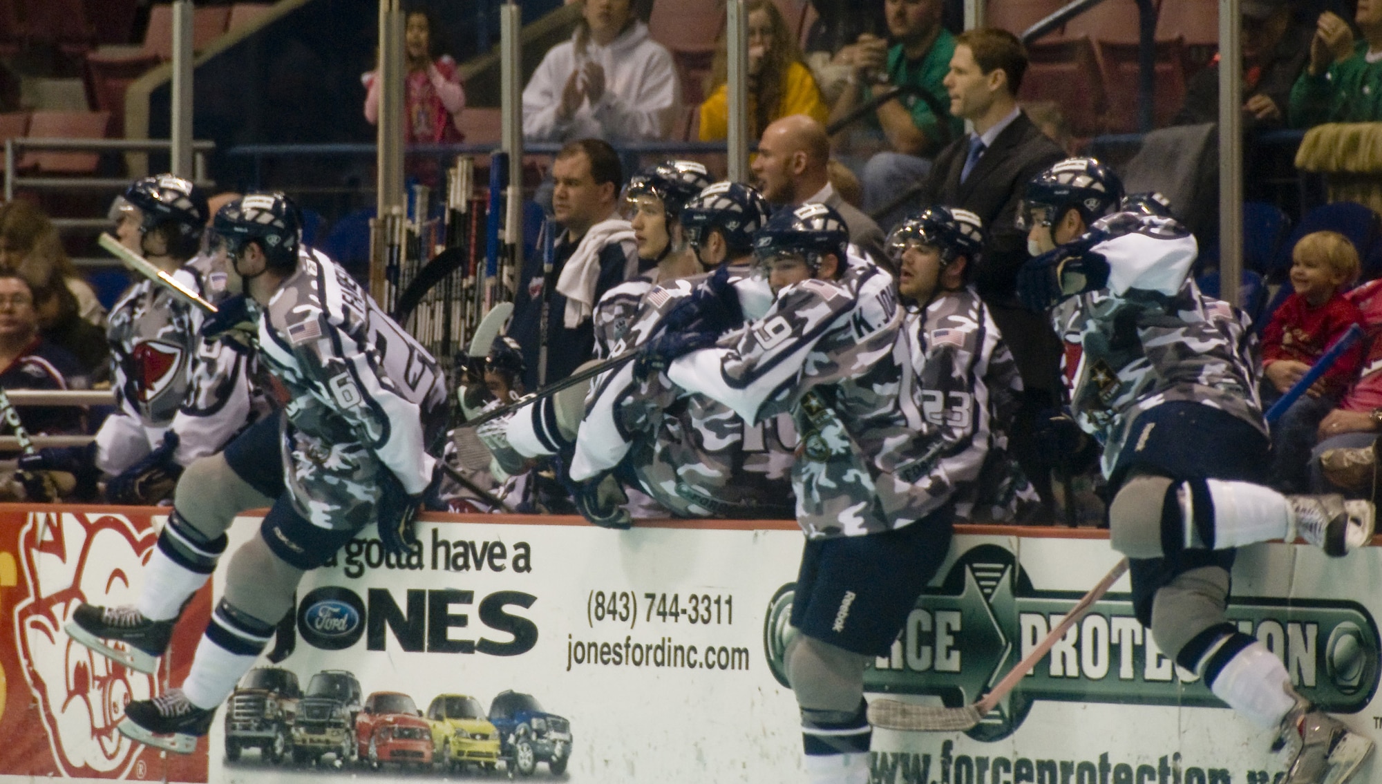 Members of the South Carolina Stingrays hockey team leap from the players box onto the ice for a quick line change during the military appreciation night hosted at the North Charleston Coliseum March 12. The team is still battling for the South Division and American Conference Titles, but is the first team to secure a playoff spot in the American Conference. (U.S. Air Force photo/Staff Sgt. Daniel Bowles)
