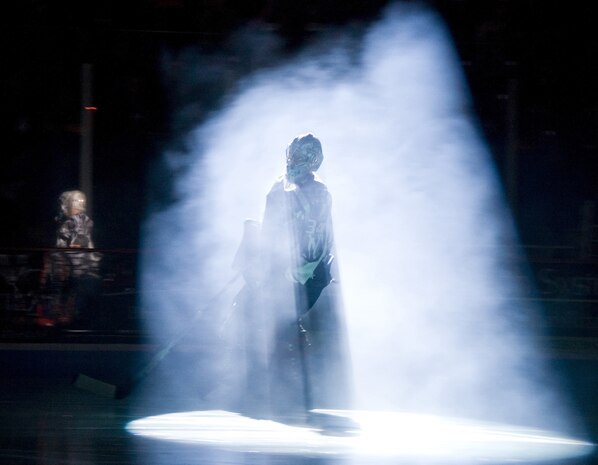 Todd Ford skates onto the ice shrouded in smoke for the opening ceremony of the South Carolina Stingrays military appreciation hockey game held at the North Charleston Coliseum March 12. Ford is a goalie for the Stingrays and aided his team to a victory over their opponents, the Florida Everblades. (U.S. Air Force photo/Staff Sgt. Daniel Bowles)