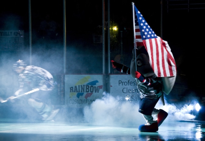 Cool Ray, the mascot of the South Carolina Stingrays, shows off his patriotism March 12 at the military appreciation night held at the North Charleston Coliseum as players take the ice. The Stingrays honored military members with free tickets, military shoutouts and patriotic music throughout the game. (U.S. Air Force photo/Staff Sgt. Daniel Bowles)
