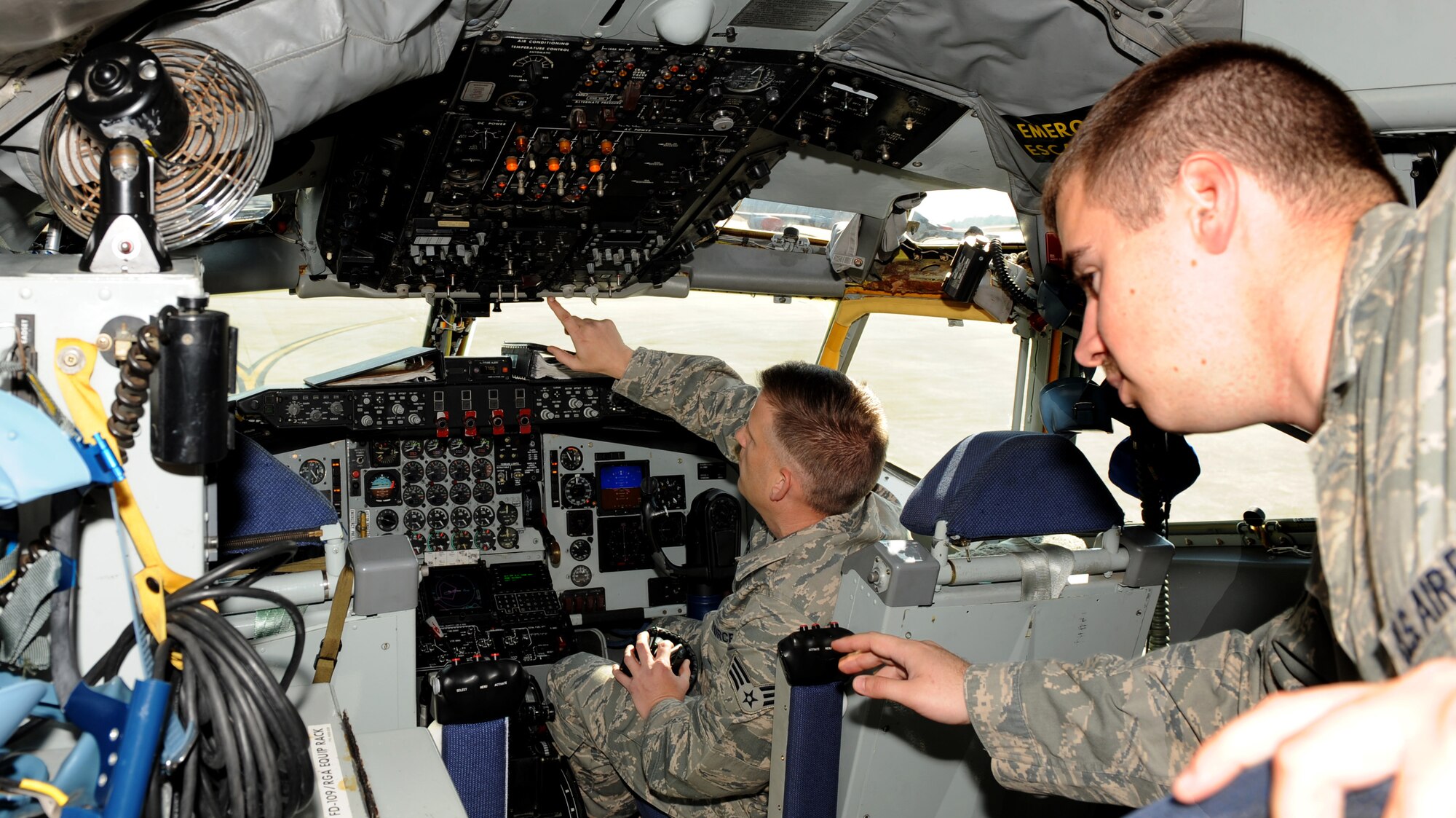 Staff Sgt. Dwayne Elders, 911th Air Refueling Squadron avionics craftsman, and Senior Airman Christopher Fuller, 916th Air Refueling Wing avionics apprentice, perform an inertial navigation system test on a KC-135R Stratotanker on Seymour Johnson Air Force Base, N.C., March 15, 2010. Elders is training Fuller how to properly perform the test so he can earn his 5-level qualification. Elders hails from Dearborn, Mich., and Fuller is a native of Holly Springs, N.C. (U.S. Air Force photo/Airman 1st Class Gino Reyes)