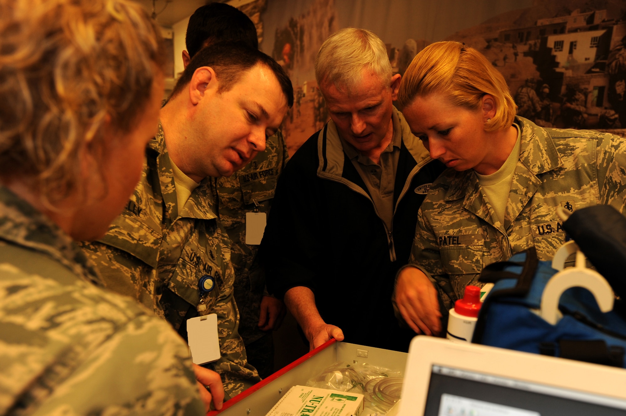 Capt. Christopher Kelly, left, Dr. Thomas McKnight, center, and Tech. Sgt. Sonya Patel, right, of the 1st Special Operations Medical Operations Squadron review the contents of a medical drawer at the 1st Special Operations Medical Group laboratory at Hurlburt Field March 11. The 1st SOMDG marked its second annual National Patient Safety Awareness Week, a national education and awareness-building campaign for improving patient safety at the local level. (U.S. Air Force photo by Senior Airman Matthew Loken)