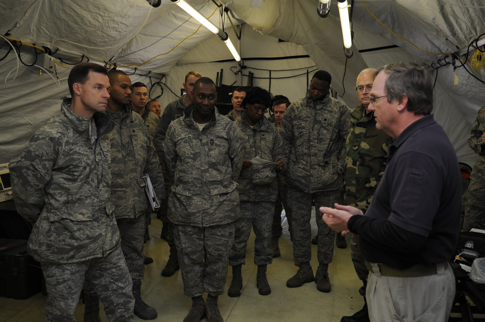 U.S. Air Force Brig. Gen. Mark Dillon, 86th Airlift Wing commander, and Command Chief Master Sgt. Vernon Butler, tour the Expeditionary Medical Support (EMEDS) training facility, Ramstein Air Base, Germany, March 17, 2010. The EMEDS course teaches and evaluates corps specific field situations as well as offers updates in Air Force Medical Service concept of operations and doctrine. It also teaches setup and packing out of a field EMEDS compound, deployed operations, field medical, nursing and operational support equipment proficiency, field exercises to both emphasize and evaluate learning of concepts taught. (U.S. Air Force photo by Airman 1st Class Caleb Pierce)