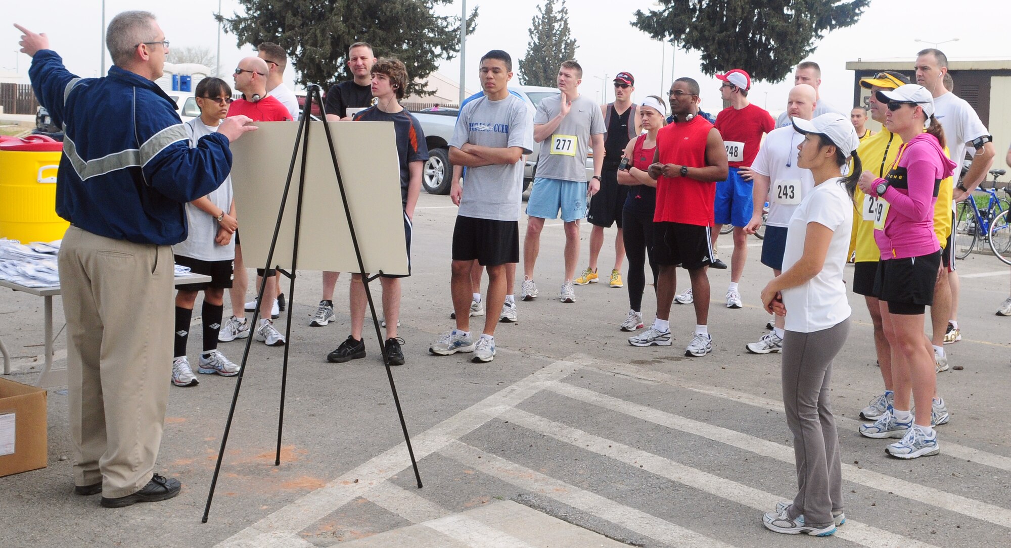 Ernest Fasoldt, 39th Force Support Squadron fitness center manager, describes the running and biking route of the Strain your Brain Duathlon to participants before the race Saturday, March 13 at Incirlik Air Base, Turkey. The race, a modified duathlon, consisted of a 5K run and 12K bike, and more than 30 people participated in the fitness event. Prizes such as base exchange gift certificates and base theater passes were given to the top three men (under 30 and over 30) and women. At a time of 38:54, Staff Sgt. Brad Williams, 39th Maintenance Squadron, earned the best time for the men and Kim Ventura, wife of Anthony Ventura, Incirlik Army & Air Force Exchange Service manager, earned the best time for the women at 51:18. (U.S. Air Force photo/Senior Airman Alex Martinez)