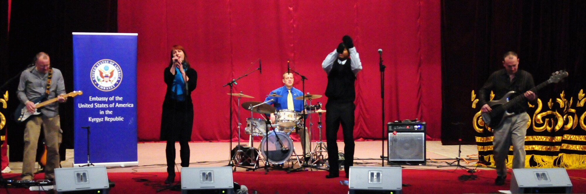 The U.S. Air Forces Central Public Affairs band “Reserve Generation” performs at the House of Culture, Tokmok, Kyrgyzstan, March 12, 2010. Members of the band from left to right are Senior Airman Josh Byrd, Airman 1st Class Jill Marie Diem, Tech. Sgt. David Vittetoe, Master Sgt. Aaron Miles, and Airman 1st Class Darren King. (U.S. Air Force photo/Senior Master Sgt. Mike Litsey/Released) 