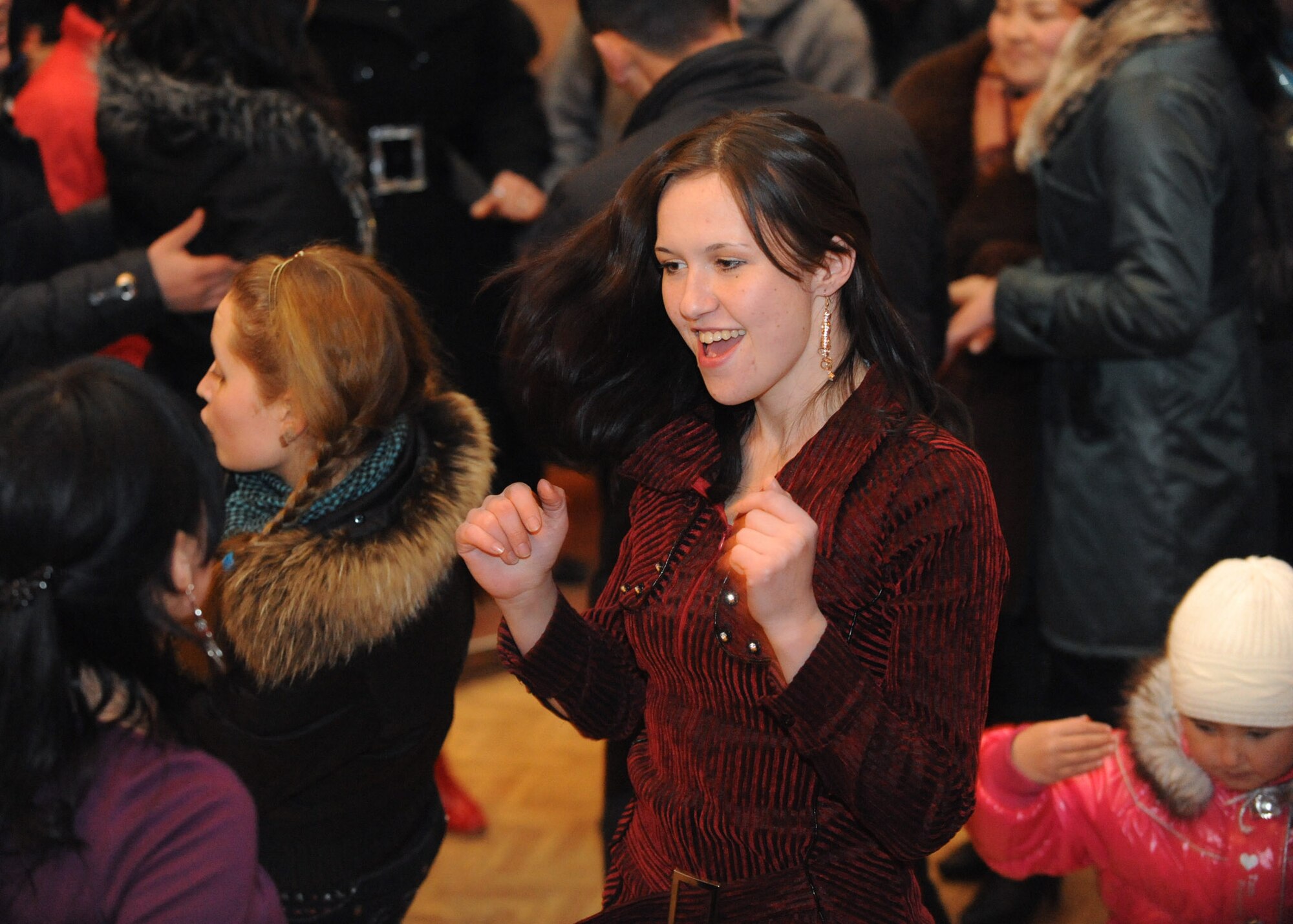 U.S. Air Forces Central Public Affairs band ?Reserve Generation? draws audience members out of their seat and onto the dance floor during their performance at the House of Culture in Tokmok, Kyrgyzstan, March 12, 2010. The band played and sang at five local venues and twice at the Transit Center at Manas during their tour through Kyrgyzstan March 5 to 14, 2010. (U.S. Air Force photo/Senior Airman Nichelle Anderson/released)