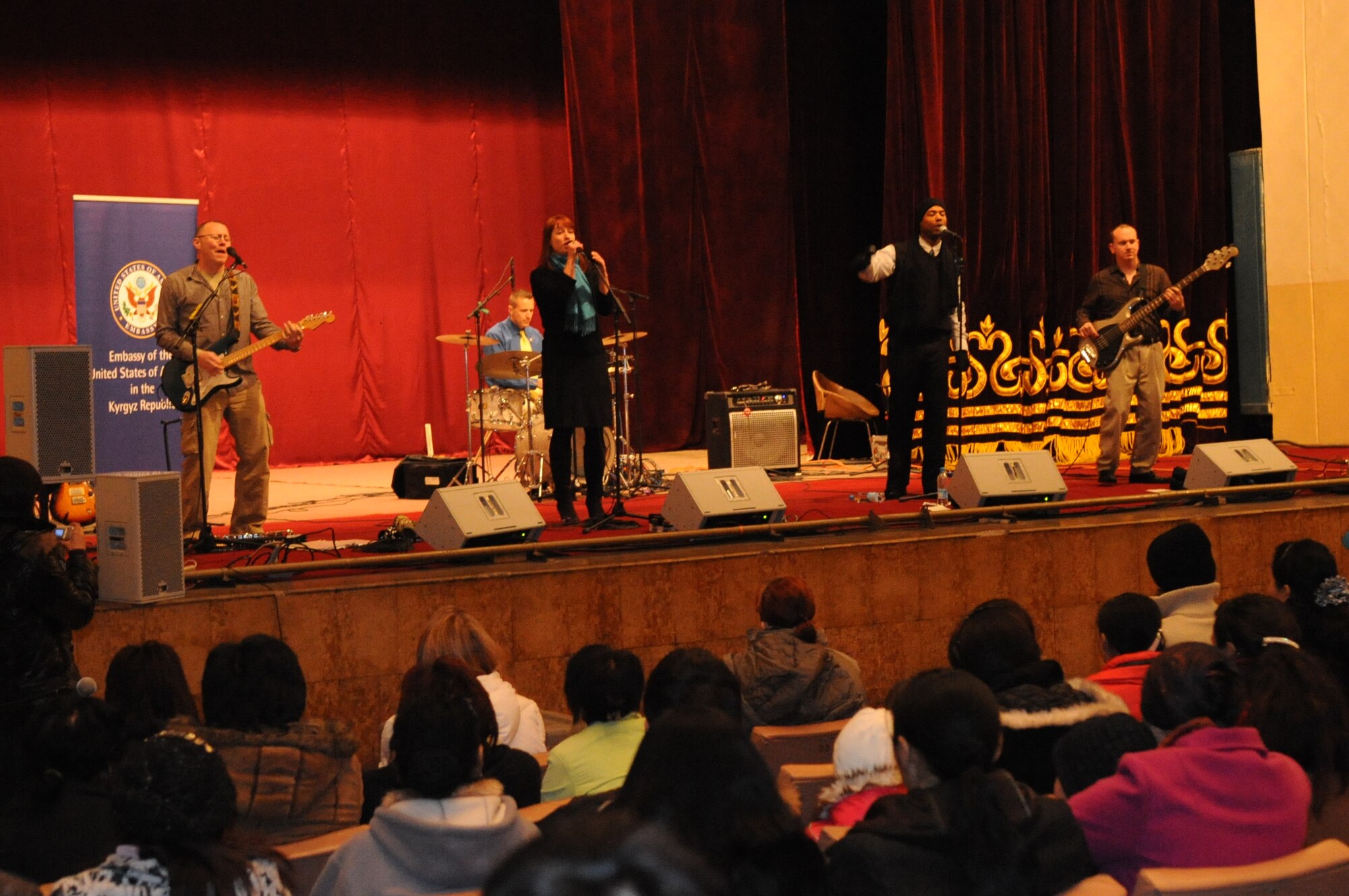 U.S. Air Forces Central Public Affairs band ?Reserve Generation? performs for the House of Culture in Tokmok, Kyrgyzstan, March 12, 2010. The band played and sang at five local venues and twice at the Transit Center at Manas during their tour through Kyrgyzstan March 5 to 14, 2010. (U.S. Air Force photo/Senior Airman Nichelle Anderson/released)