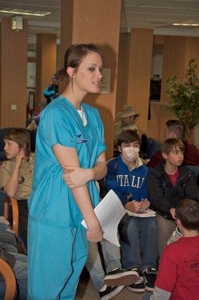 U.S. Air Force Airman 1st Class Jacqueline Grubbs (center), 86th Dental Squadron dental technician, talks to Boy Scouts from troops around the Kaiserslautern Military Community area about the importance of dental care. The 86th DS volunteered their weekend to help give the Scouts their Dentistry Merit Badge. (Courtesy photo)