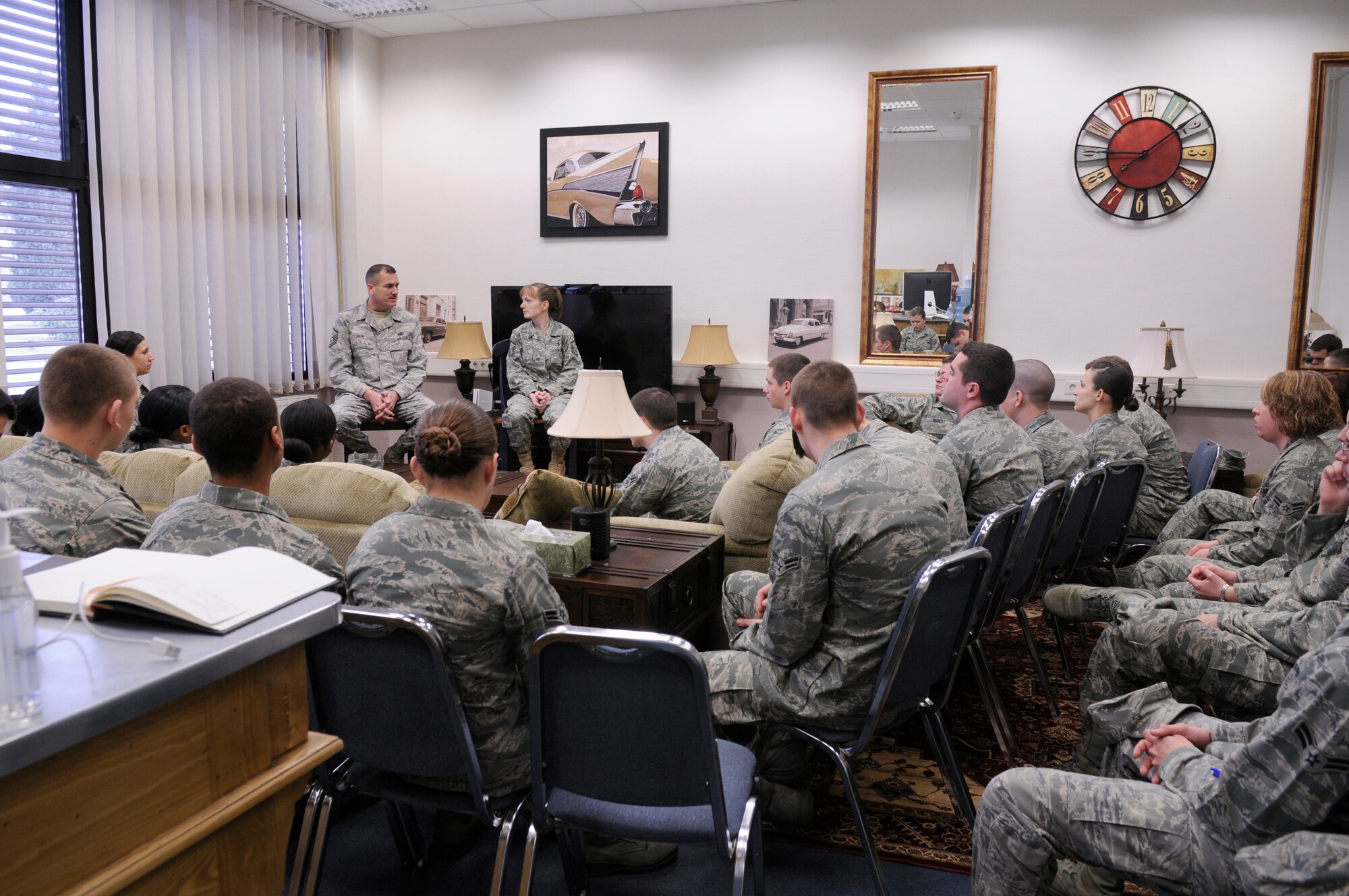 U.S. Air Force 1st Sergeants, Master Sgt. Jeffrey Bise, 1st Communications Maintenance Squadron and Betsi Keltz, 435th Air Mobility Squadron, talk to students from the First Term Airmen Center at Club 7 Cafe, Ramstein Air Base, Germany, March 16, 2010. The Chapel established Club 7 due to a new Air Force initiative to provide an effective venue to minister to the spiritual and physical needs of single Airmen. (U.S. Air Force photo by Airman 1st Class Brittany Perry)
