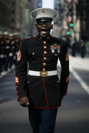 NEW YORK -- Gunnery Sgt. Lionel Saulsberry, assistant Marine officer instructor, Merchant Marine Academy, and Youngstown, Ohio native, marches a formation of Marines during the 249th St. Patrick's Day Parade, here, March 17. A contingent of more than 300 Marines, including the Quantico Marine Corps Band, ceremonial marchers from Marine Barracks Washington, active and reserve Marines and Marine Corps League members from the New York area, marched in honor of Grand Marshal Raymond W. Kelly, New York City Police Commissioner and retired Marine Corps colonel. (Official Marine Corps photo by Sgt. Randall A. Clinton / RELEASED)