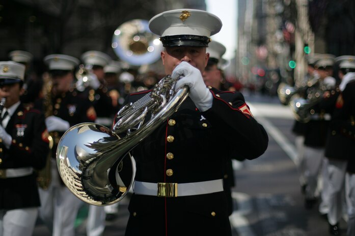 NEW YORK -- A member of the Quantico Marine Corps Band plays his French horn during the 249th St. Patrick's Day Parade, here, March 17. A contingent of more than 300 Marines, including the Quantico Marine Corps Band, ceremonial marchers from Marine Barracks Washington, active and reserve Marines and Marine Corps League members from the New York area, marched in honor of Grand Marshal Raymond W. Kelly, New York City Police Commissioner and retired Marine Corps colonel. (Official Marine Corps photo by Sgt. Randall A. Clinton / RELEASED)