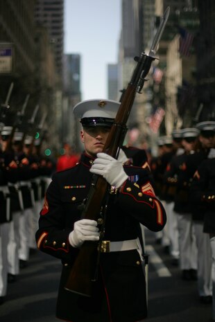 NEW YORK -- A ceremonial marching Marine from 1st platoon, Company A, Marine Barracks Washington, carries his rifle during the 249th St. Patrick's Day Parade, here, March 17. A contingent of more than 300 Marines, including the Quantico Marine Corps Band, ceremonial marchers from Marine Barracks Washington, active and reserve Marines and Marine Corps League members from the New York area, marched in honor of Grand Marshal Raymond W. Kelly, New York City Police Commissioner and retired Marine Corps colonel. (Official Marine Corps photo by Sgt. Randall A. Clinton / RELEASED)