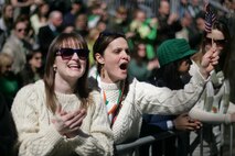 NEW YORK -- Viewers wave and cheer as a formation of Marines passes by during the 249th St. Patrick's Day Parade, here, March 17. A contingent of more than 300 Marines, including the Quantico Marine Corps Band, ceremonial marchers from Marine Barracks Washington, active and reserve Marines and Marine Corps League members from the New York area, marched in honor of Grand Marshal Raymond W. Kelly, New York City Police Commissioner and retired Marine Corps colonel. (Official Marine Corps photo by Sgt. Randall A. Clinton / RELEASED)