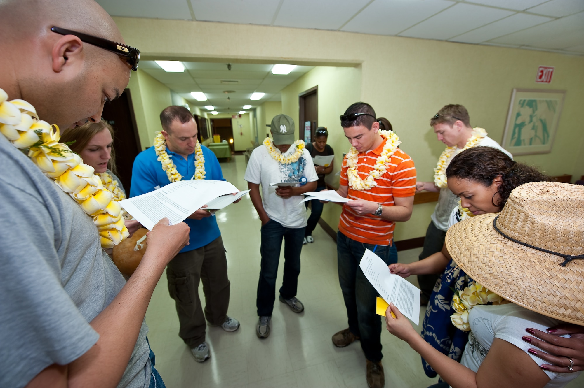 U.S. Air Force Staff Sgt. Harry Mitchell (left), Medical Technician, 140th Wing Medical Group, Buckley Air Force Base, reads a data sheet to the group about the ethnic facts & figures of the Hawaiian population at the cultural familiarization briefing, Kahuku Medical Center, Kahuku, Hawaii, March 14, 2010. Mitchell and more than 60 of his fellow Colorado Air National Guardsman are on the island of Oahu providing services to the medically under-served within the State of Hawaii (U.S. Air Force photo/Master Sgt. John Nimmo, Sr.) (RELEASED)

