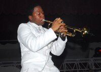 Senior Airman Anthoney Williams does a rendition of Louis Armstrong's "Hello Dolly" during the Tops In Blue concert March 13 at the Bob Hope Performing Arts Center. Airman Williams is with the 35th Civil Engineer Squadron, Misawa Air Base, Japan. (U.S. Air Force photo/Alan Boedeker)