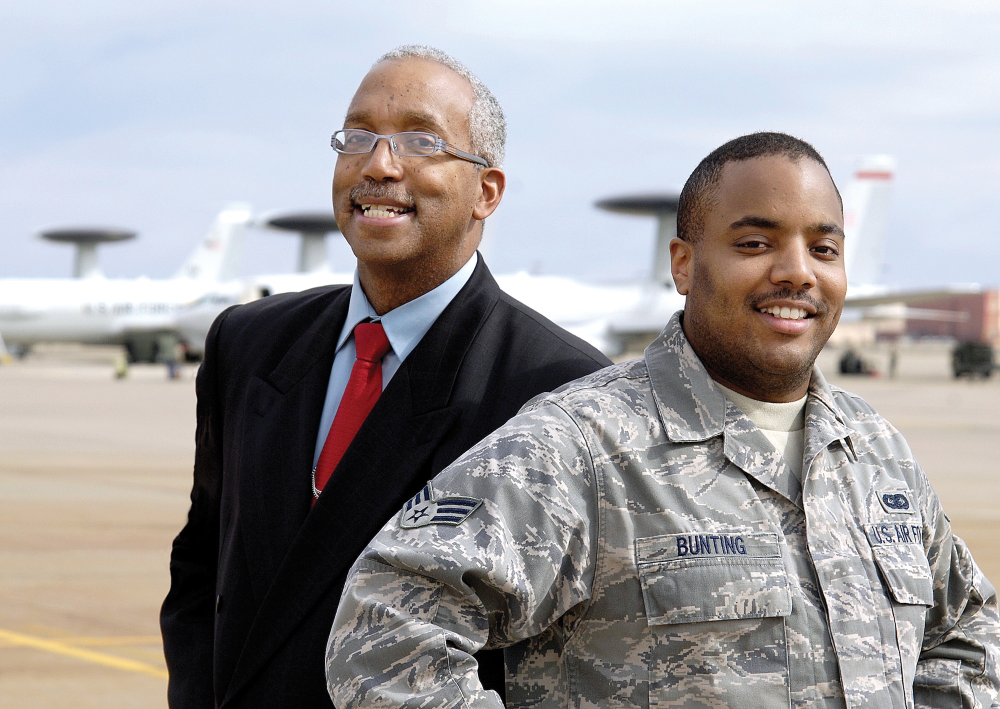 Retired Lt. Col. Larry Bunting, the U.K. AWACs program manager for the 552nd Air Control Wing, and his son, Senior Airman Samuel Bunting, 552nd Operations Group, are the third and fourth generations of their family to serve in the military. (Air Force photo by Margo Wright)