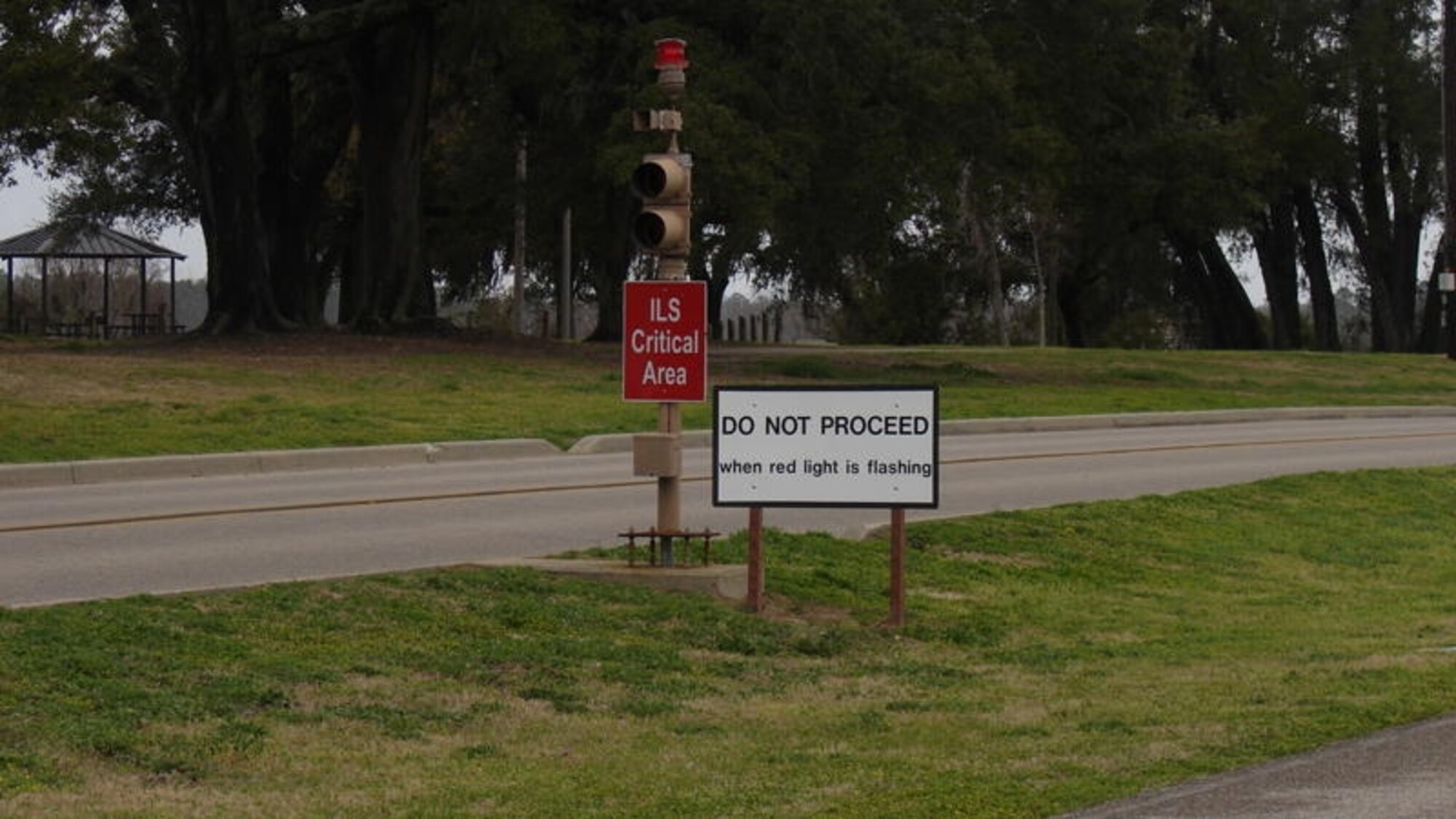 Signal lights and new signs, like these near marina park, are intended to halt vehicular and pedestrian traffic near the instrument landing system critical areas.  (Courtesy photo)