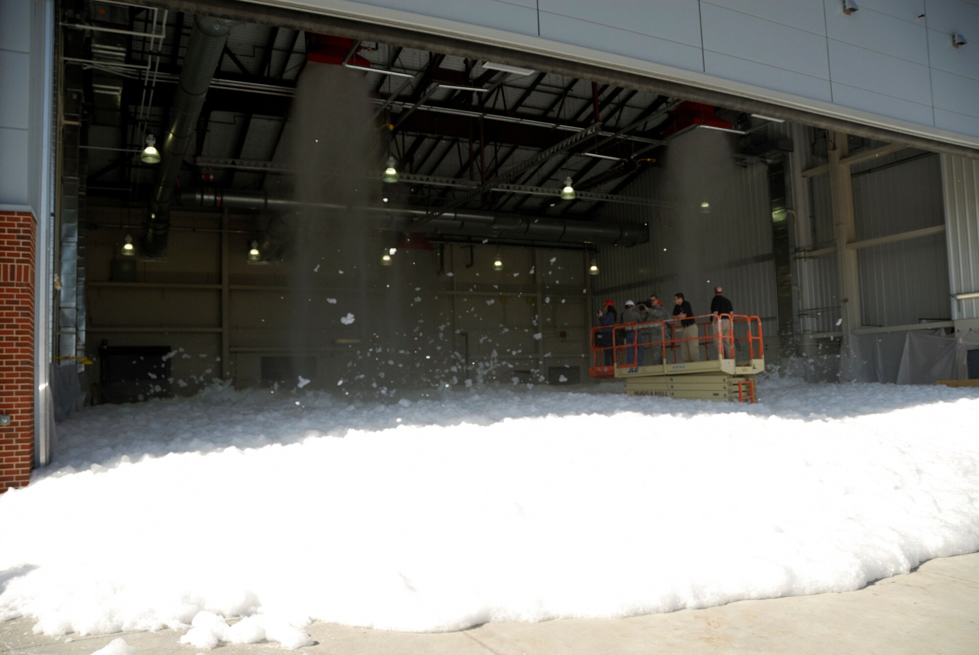 The 188th Fighter Wing conducts a validation test of the high-expansion foam system in the unit's new consolidated maintenance facility in Fort Smith, Ark. This was the only test of the foam system, which functions as fire suppression. The 188th's consolidated maintenance facility was recently LEED Silver certified. It was the first maintenance facility in the ANG to achieve such a rating. (U.S. Air Force photo by Tech Sgt. Stephen Hornsey/188th Fighter Wing Public Affairs)
