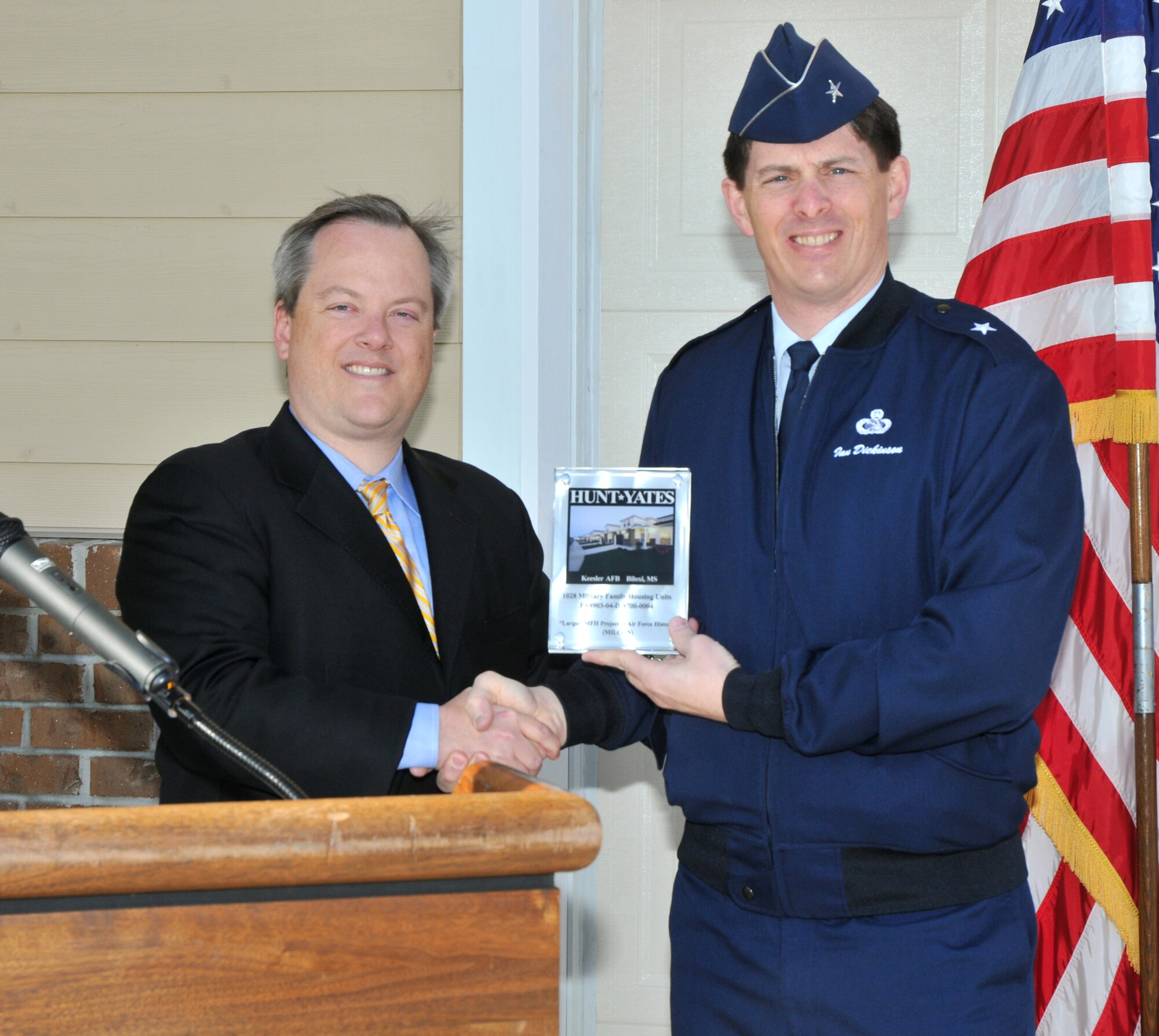 Mr. Yates presents a plaque to General Dickinson commemorating the project.  (U.S. Air Force photo by Adam Bond)

