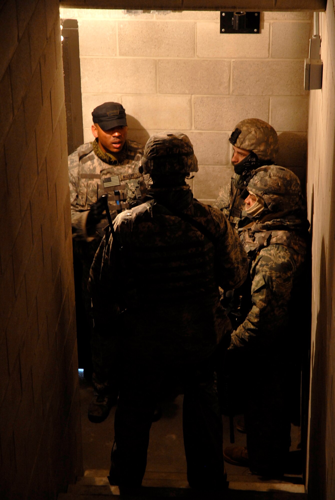 Staff Sgt. Charles Miller from the 421st Combat Training Squadron at the U.S. Air Force Expeditionary Center, teaches deploying security forces Airmen how to clear stairwells during urban operations training as part of a pre-deployment training course on a range at Joint Base McGuire-Dix-Lakehurst, N.J. March 13, 2010. (U.S. Air Force Photo/Tech. Sgt. Paul R. Evans)