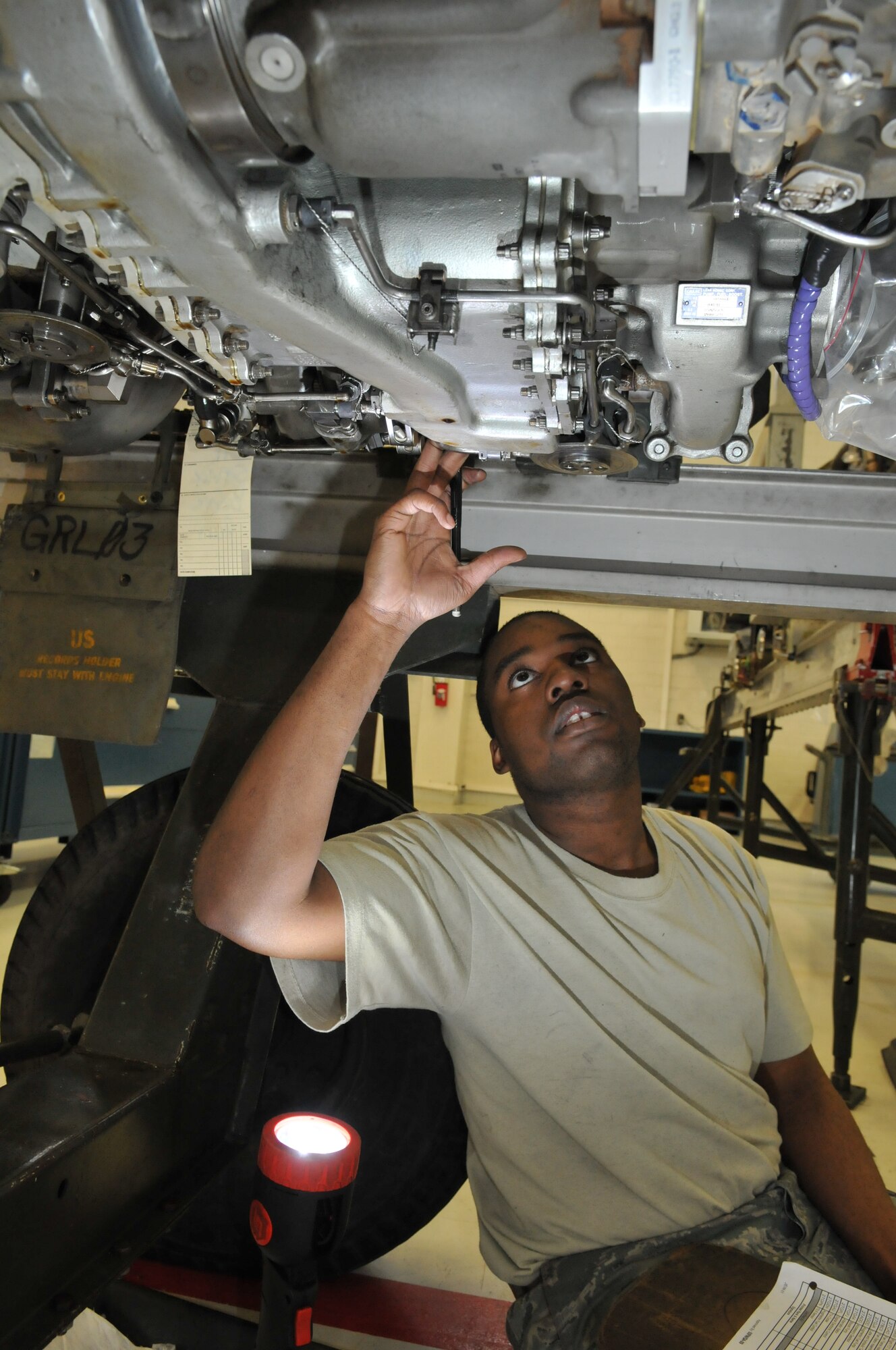 SPANGDAHLEM AIR BASE, Germany – Senior Airman Christopher Mason, 52nd Component Maintenance Squadron aerospace propulsion systems journeyman, checks serial numbers on components of an F-16 Fighting Falcon engine March 16. This check must be performed prior to installing the engine on the aircraft. (U.S. Air Force photo/Airman 1st Class Nick Wilson)