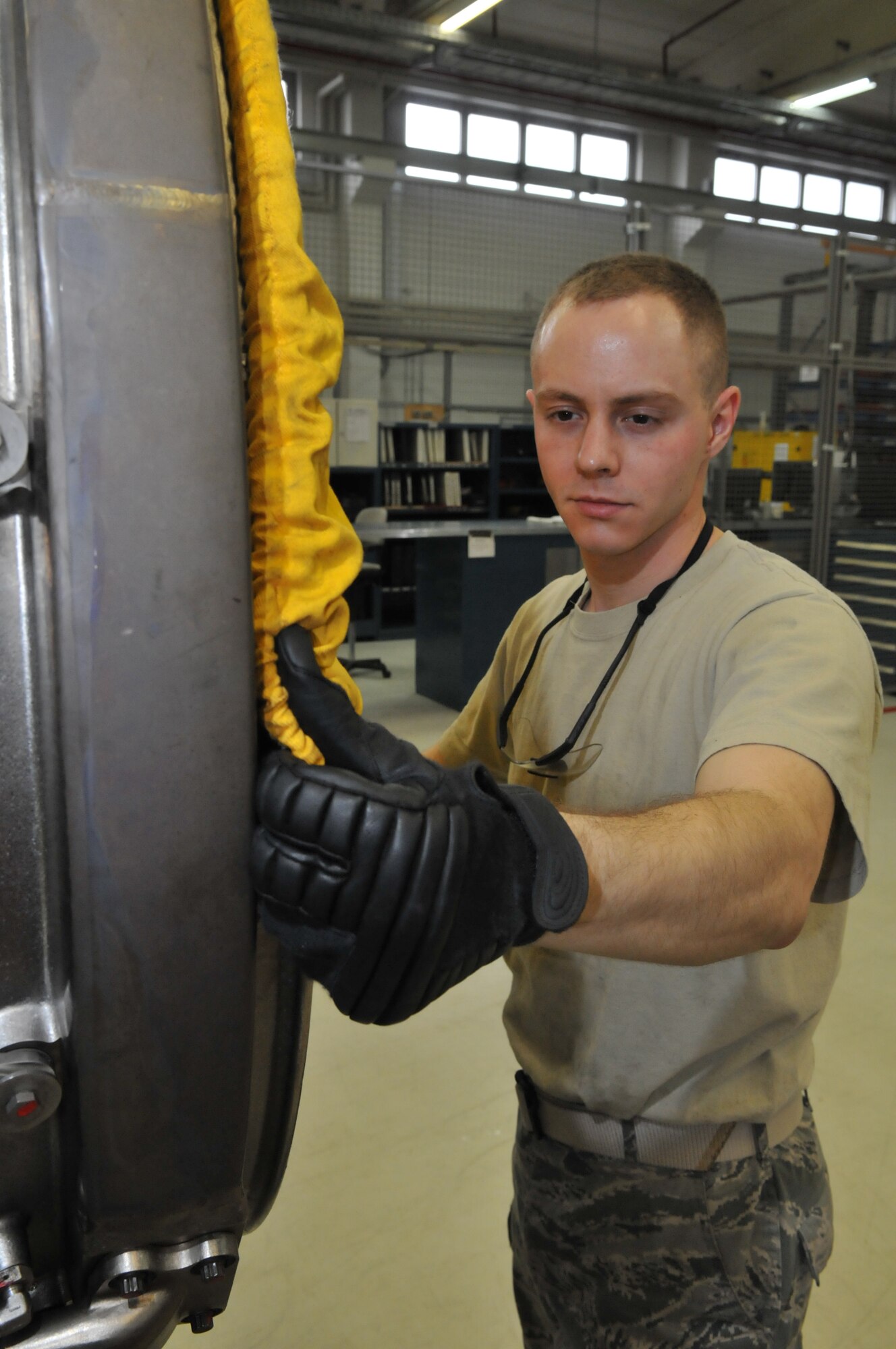 SPANGDAHLEM AIR BASE, Germany – Senior Airman Patrick Petersen, 52nd Component Maintenance Squadron aerospace propulsion systems journeyman, installs an inlet cover on an F-16 Fighting Falcon engine March 16. This foreign object damage prevention practice preserves the engine’s interior. (U.S. Air Force photo/Airman 1st Class Nick Wilson)