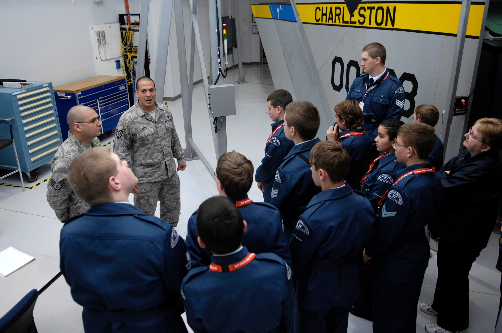 U.S. Air Force Staff Sgt. Christopher Simmons and Tech. Sgt. Leslie Bell speak to a group of Royal Canadian Air Force Cadets at the Field Training Detachment on Joint Base Charleston, S.C., March 16, 2010. The FTD is used to train pipeline-Airmen how to work on C-17s. During their tour, the cadets visited the training areas for the C-17 engine, tail and cockpit. Sergeant Simmons and Sergeant Bell are aircraft maintenance instructors with the 373rd Training Squadron based out of Sheppard AFB, Texas. (U.S. Air Force photo/Airman 1st Class Lauren Main)