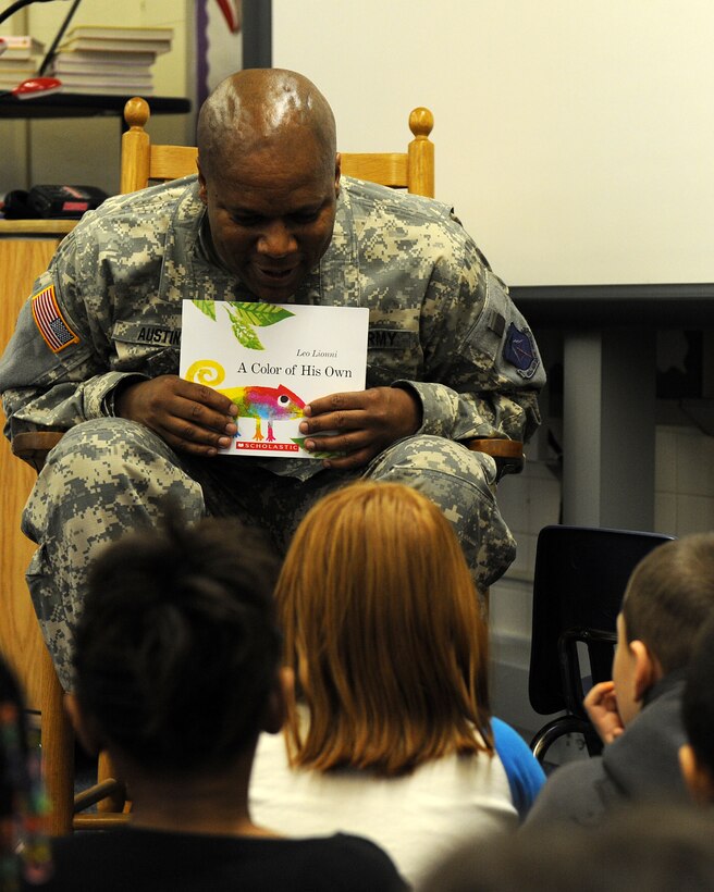 LANGLEY AIR FORCE BASE, Va. -- Col. Reggie Austin, 633d Air Base Wing vice commander, reads "A Color of His Own" by Leo Lionni to Ms. Allen's class at Burbank Elementary School March 18.  Austin and several Langley Airmen often support the Mayor’s Book Club by reading to local area elementary school students. (U.S. Air Force photo/Senior Airman Zachary Wolf)
