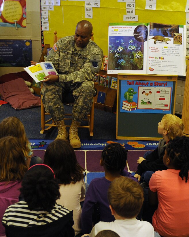 LANGLEY AIR FORCE BASE, Va. -- Col. Reggie Austin, 633d Air Base Wing vice commander, reads "A Color of His Own" by Leo Lionni to Ms. Saab's class at Burbank Elementary School March 18.  Austin and several Langley Airmen often support the Mayor’s Book Club by reading to local area elementary school students. (U.S. Air Force photo/Senior Airman Zachary Wolf)
