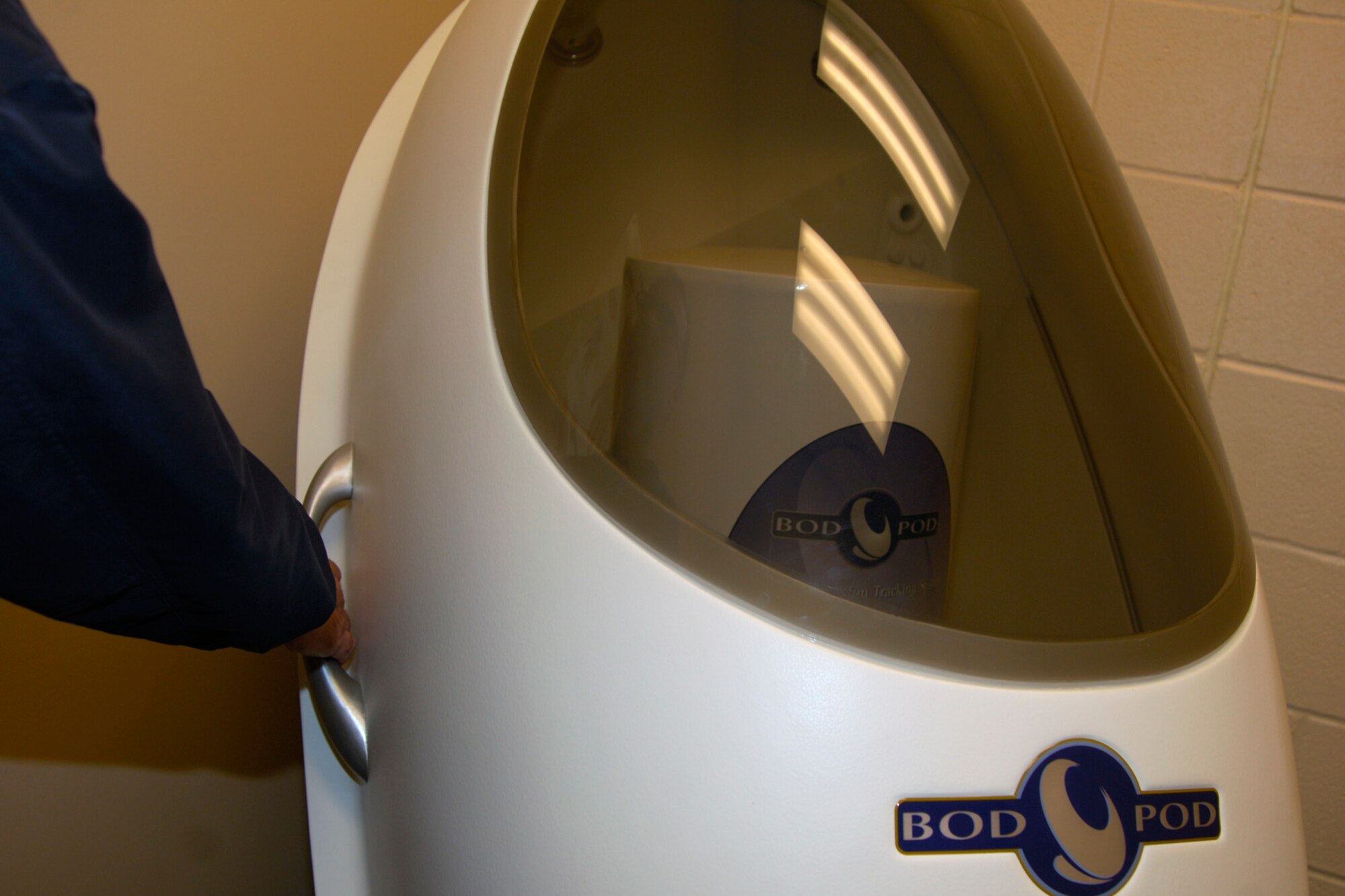 A HAWC member inspects a new Body Composition Tracking System, the Bod Pod,  Feb. 18, 2010, at McConnell Air Force Base, Kan. The Bod Pod, which will be available at the HAWC in mid-April, is a computerized chamber that measures a person’s body fat and lean muscle mass in less than four minutes. It has already been implemented at more than 20 Air Force bases. (U.S. Air Force photo/ Staff Sgt. Anthony Mejia)
