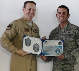 KABUL INTERNATIONAL AIRPORT, Afghanistan - Brig. Gen. Michael Boera, 438th Air Expeditionary Wing commander, promotes Tech. Sgt. Michael Parker, deployed from the 633d Force Support Squadron, through the Stripes for Exceptional Performers program Feb. 8. Parker, who received his master sergeant stripe, is deployed on a 365-day joint tasking with the 438 AEW Combined Air Power Transition Force Combined Security Transition Command-Afghanistan. (Courtesy photo)