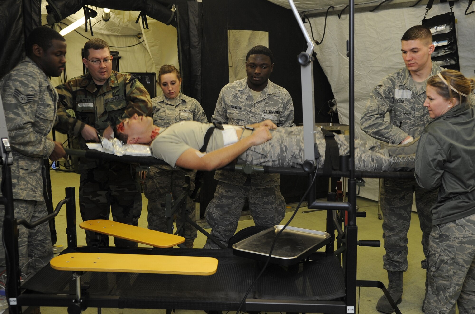 U.S. Air Force medical members participate in a mass casualty exercise during the Expeditionary Medical Support (EMEDS) Mobile Course training, Ramstein Air Base, Germany, March 17, 2010. The EMEDS course teaches and evaluates corps specific field situations as well as offers updates in Air Force Medical Service concept of operations and doctrine. It also teaches setup and packing out of a field EMEDS compound, deployed operations, field medical, nursing and operational support equipment proficiency, field exercises to both emphasize and evaluate learning of concepts taught. (U.S. Air Force photo by Airman 1st Class Caleb Pierce)