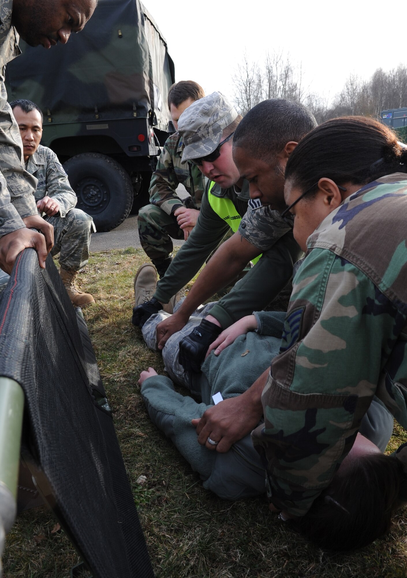 U.S. Air Force medical members participate in a mass casualty exercise during the Expeditionary Medical Support (EMEDS) Mobile Course training, Ramstein Air Base, Germany, March 17, 2010. The EMEDS course teaches and evaluates corps specific field situations as well as offers updates in Air Force Medical Service concept of operations and doctrine. It also teaches setup and packing out of a field EMEDS compound, deployed operations, field medical, nursing and operational support equipment proficiency, field exercises to both emphasize and evaluate learning of concepts taught. (U.S. Air Force photo by Airman 1st Class Caleb Pierce)