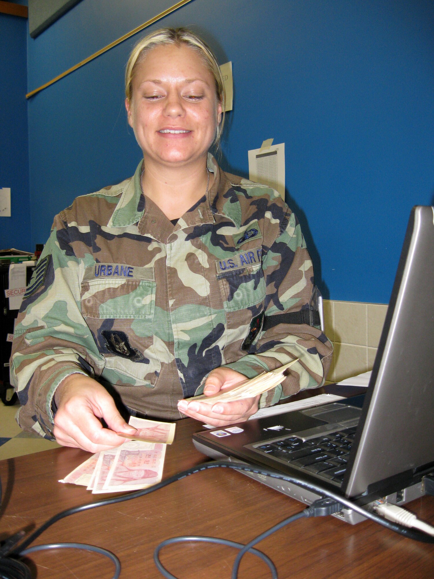 VOLK FIELD, WISC., -- Tech. Sgt. Robin Urbane, a financial management journeyman, counts money as she prepares to perform cashier duties during a recent Operational Readiness Inspection.  The inspection tested a vareity of wartime skills and duties.  (U.S. Air Force photo/Tech. Sgt. Mark R. W. Orders-Woempner)