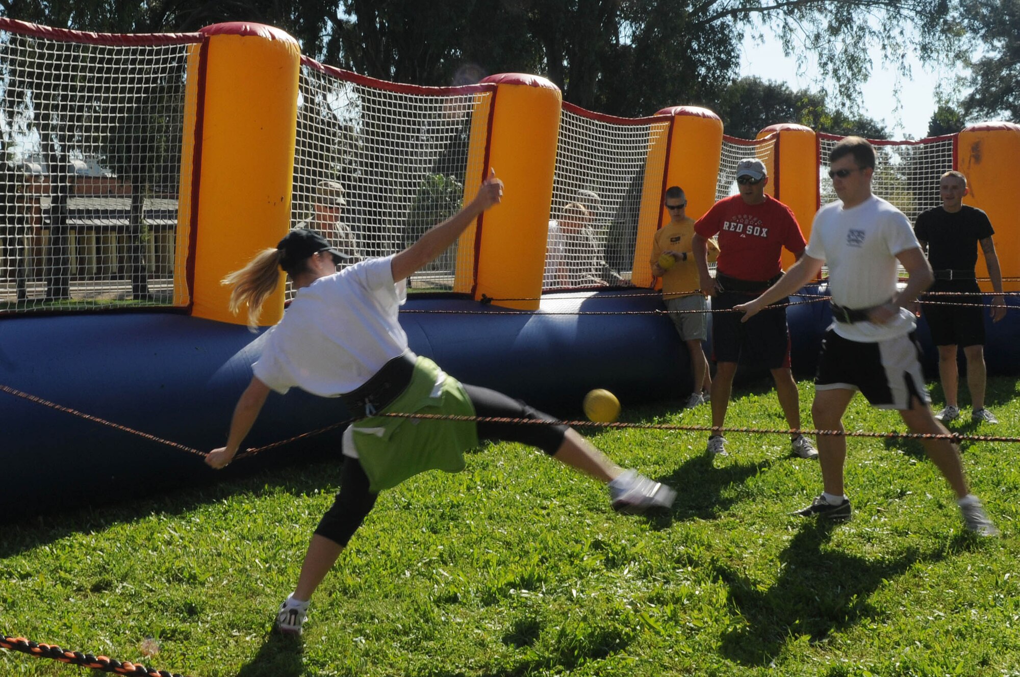 Christine Frazier, 39th Force Support Squadron, tries to get the ball past Airman 1st Class Kenneth Dunn, 39th Civil Engineer Squadron, during a game of human foosball Wednesday, March 17, 2010 at Incirlik Air Base, Turkey.  Teams of five had to pay $20 to play. All proceeds went to the Air Force Assistance Fund, a fundraising campaign that distributes aid money to four charities.  (U.S. Air Force photo/Senior Airman Ashley Wood)