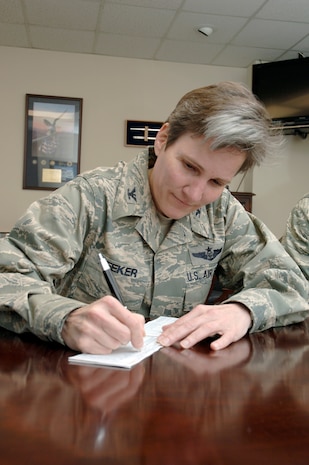 U.S. Air Force Col. Martha Meeker fills out an Air Force Assistance Fund donation form March 9, 2010, at Joint Base Charleston, S.C. The voluntary annual campaign benefits active-duty, Reserve and Guard members, as well as Air Force retirees and family members. The AFAF campaigns to benefit those with hardships and assists with financial obligations such as paying car loans during a time of financial difficulty, getting grants for college or paying for a flight to go home for a funeral. Colonel Meeker is the 628th Air Base Wing commander. (U.S. Air Force photo/Staff Sgt. Marie Brown)