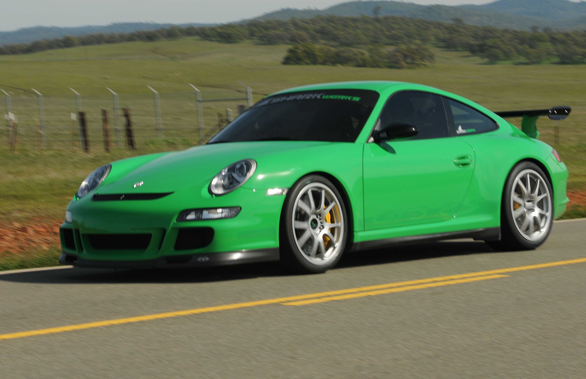 A Porsche 997 GT3RS driven by Tanner Faust, cruises down the road March 15 during a filming of SPEED Channel's Battle of the Supercars. Crews spend three days filming the episode which is currently scheduled to air early this summer. (Air Force photo by Airman 1st Class David Tracy)