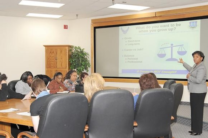 Essye Miller, director of Hill Air Force Base Communications Directorate, talks at a woman’s history event. (U.S. Air Force photo by Kim Cook)