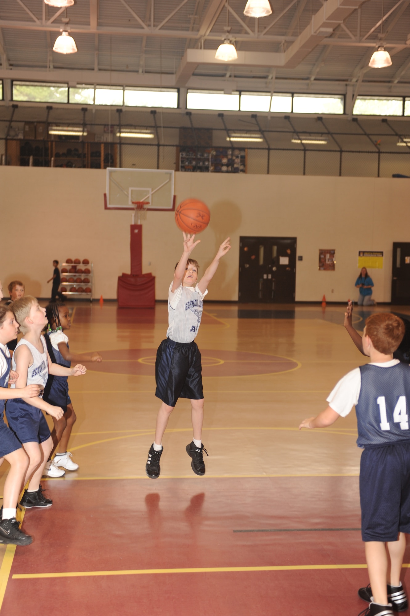 Tyler Chandler, Sharks center, takes an open jump shot during a 9-to 10-year-old end-of-season basketball game at the youth center on Seymour Johnson Air Force Base, N.C., March 13, 2010.  Youth center basketball teams are broken up into four groups based on ages.  Tyler is the son of Master Sgt. Robert Chandler, 333rd Aircraft Maintenance Unit production superintendent.  (U.S. Air Force photo/Tech. Sgt. Lesley Waters)
