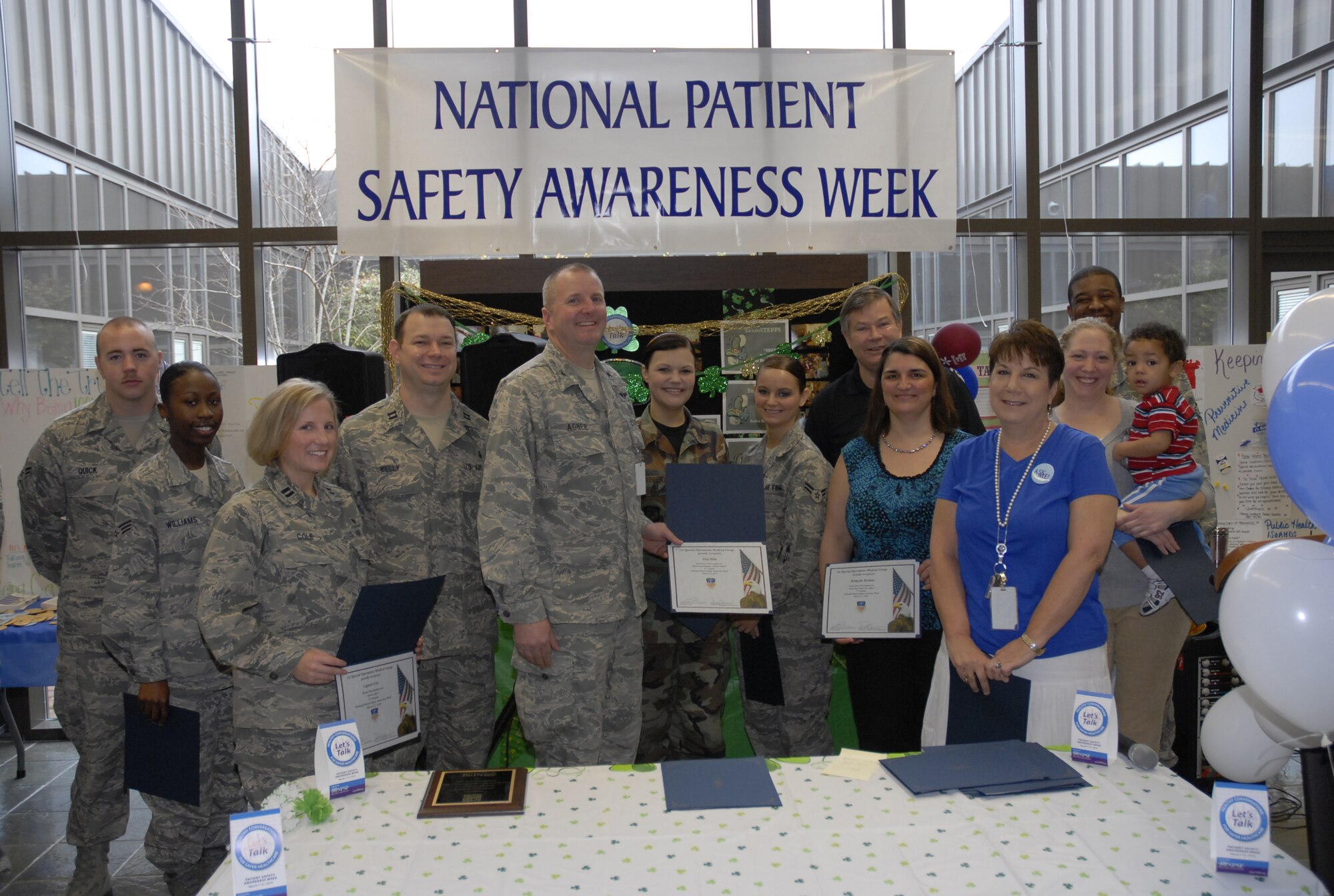 Col. Dale Agner, 1st Special Operations Medical Group commander, poses with 1st SOMDG Airmen and personnel who participated in a poster contest for National Patient Safety Awareness Week at the 1st SOMDG clinic at Hurlburt Field March 12. National Patient Safety Awareness Week is a national education and awareness-building campaign for improving patient safety at the local level. (U.S. Air Force photo by Airman 1st Class Joe McFadden)