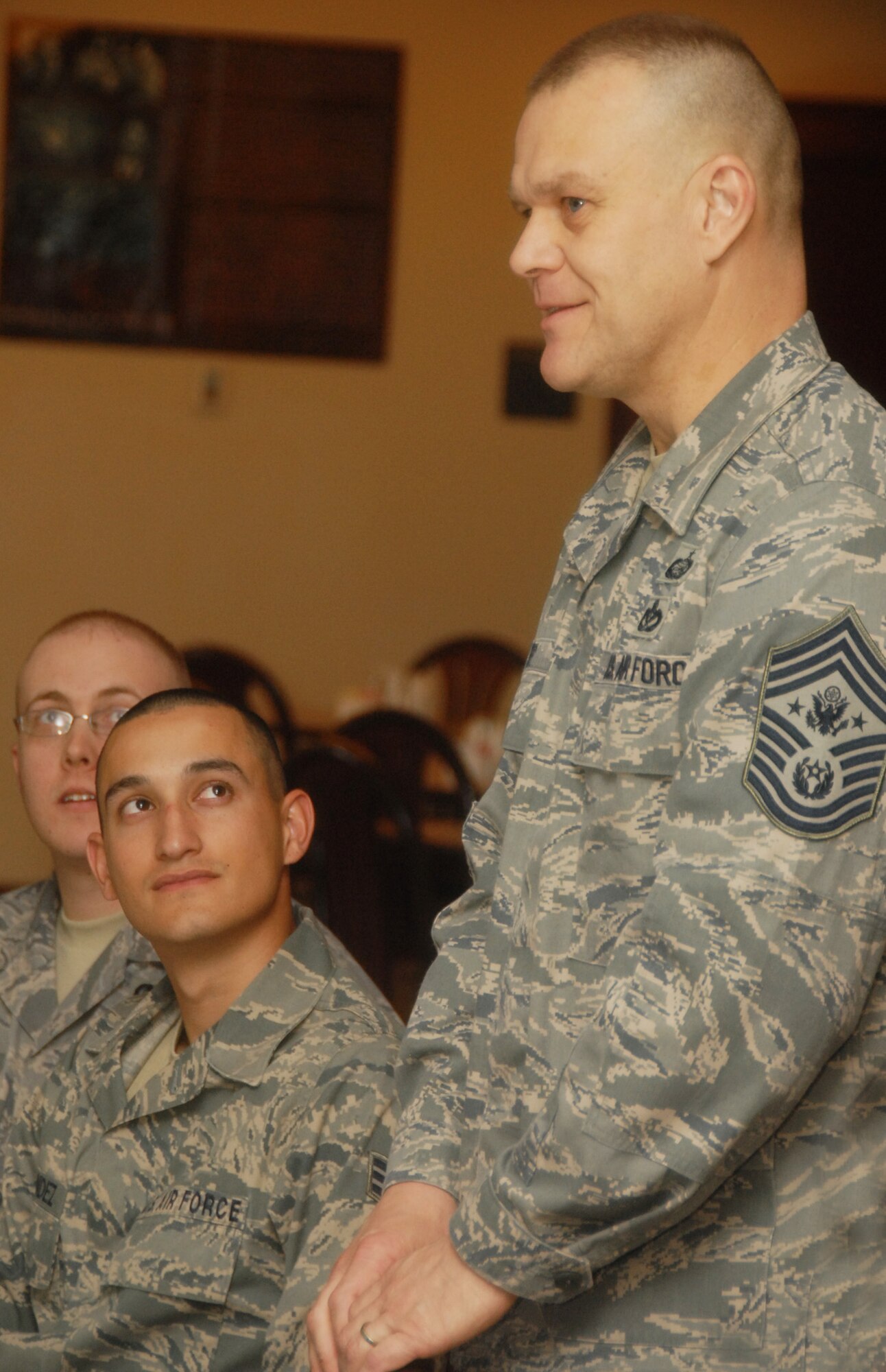 Staff Sgt. Richard Cleary, 33rd Fighter Wing and Senior Airman Robert Hernandez, 96th Communications Squadron, listen intently to Chief Master Sgt. of the Air Force James Roy at an Airmen’s’ luncheon, March 17 at  Eglin Air Force Base, Fla.  The CMSAF’s two-day visit to the base included tours of units within the various wings and speaking with junior enlisted and senior leadership on Air Force issues.  (U.S. Air Force photo/Samuel King Jr.)