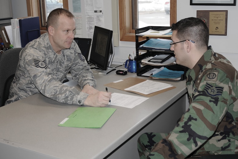 Tech. Sgt. Paul Havran, Retention Office Manager for the 132nd Force Support Squadron, Des Moines, Iowa, assists a unit member with his extension and benefits package. Sgt. Havran was recently recognized as Rookie Retention Office Manager of the Year by the Air National Guard. (U.S. Air Force/Staff Sgt. Linda E. Kephart)(released)
