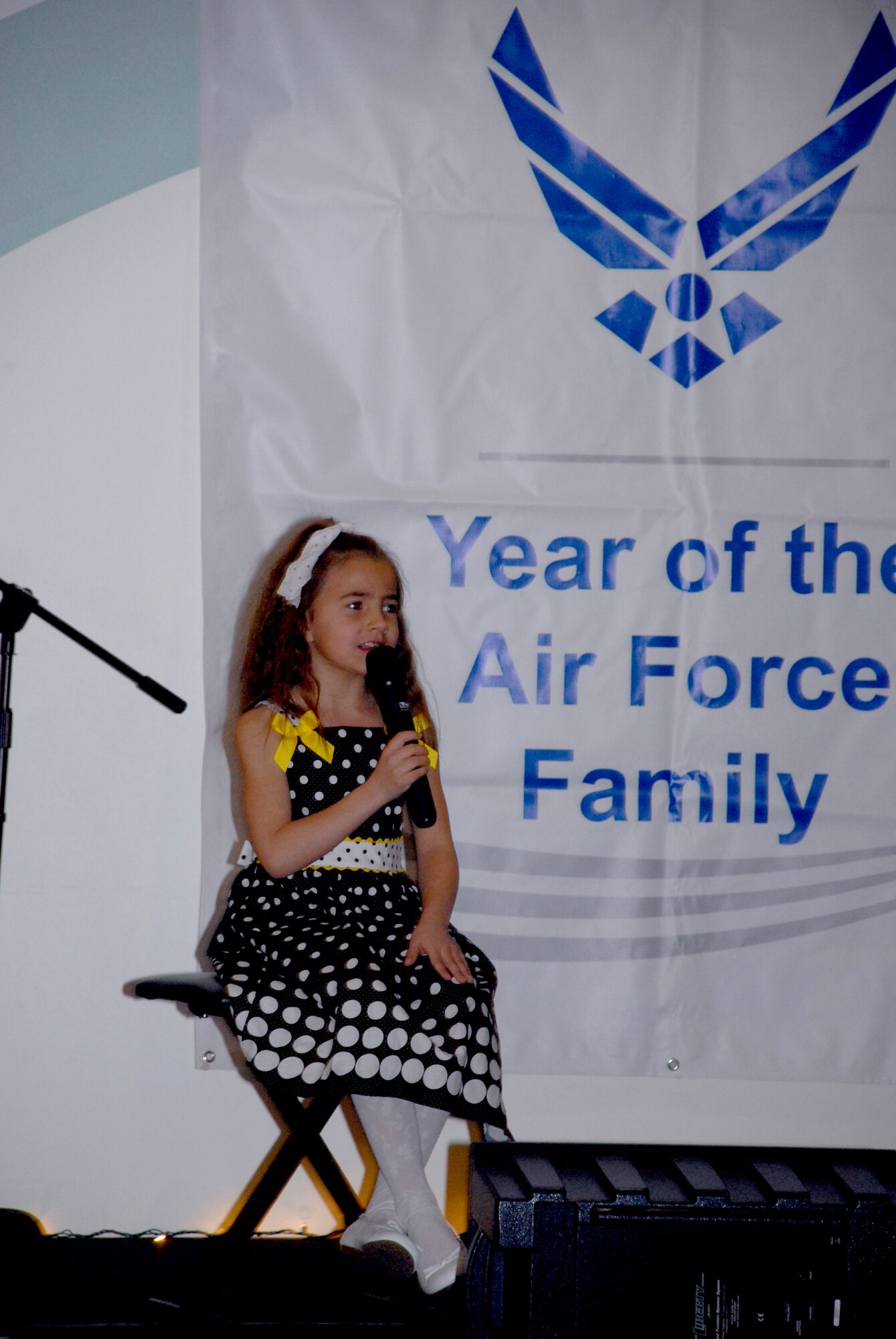 Kayla Vega performs a song from Disney's Little Mermaid during the You Got Talent Program at the Youth Center March 18. She won first place in the children's vocal division at the event. (U.S. Air Force photos/ Airman 1st Class Matthew Hubby)