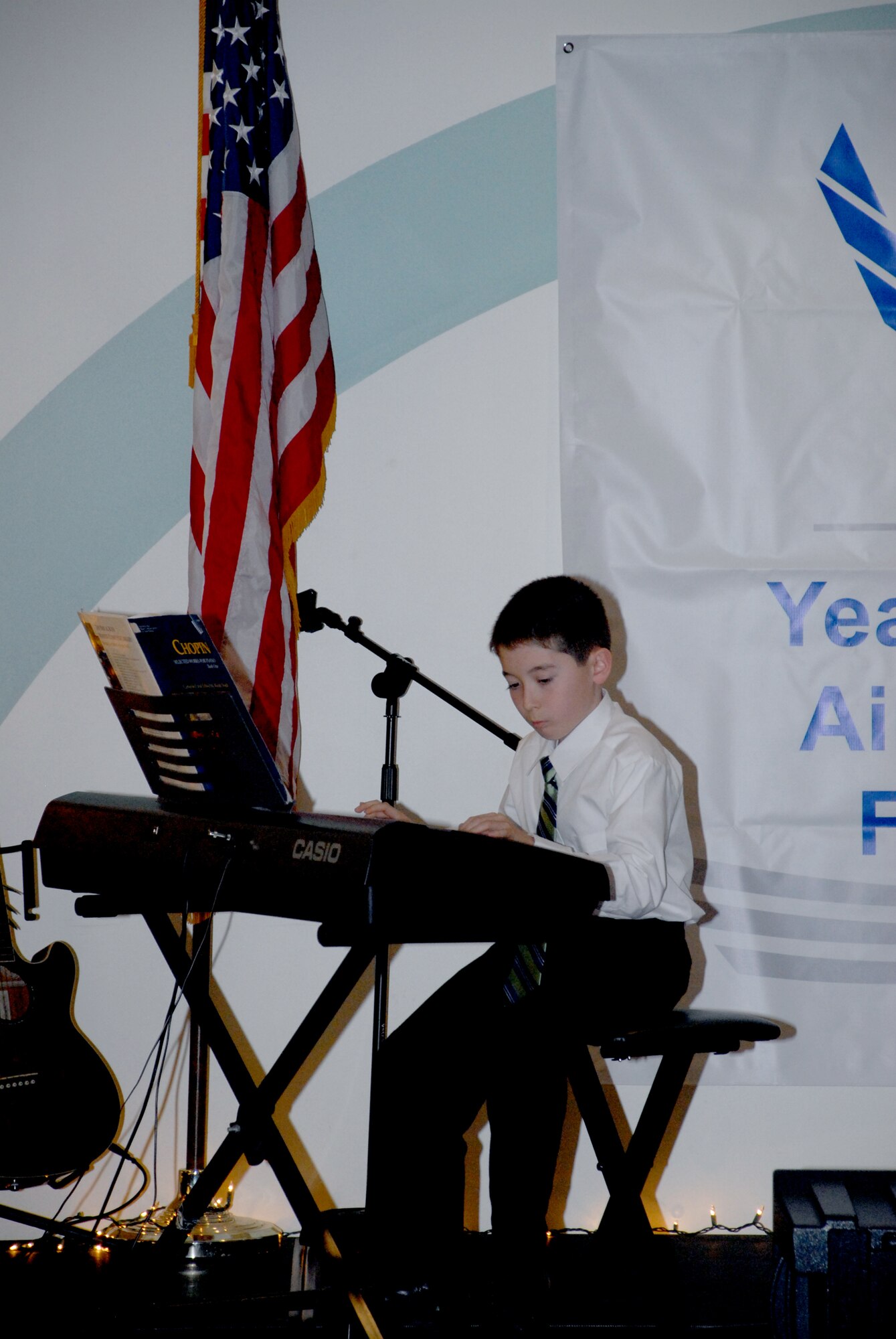 Andrew Bratcher plays 'Polonaise in G Minor' by Chopin and 'Waltz in A Minor' by Mozart during the You Got Talent Program at the Youth Center March 18. Andrew won first place in the children's instrumental division of the event. (U.S. Air Force photos/ Airman 1st Class Matthew Hubby)